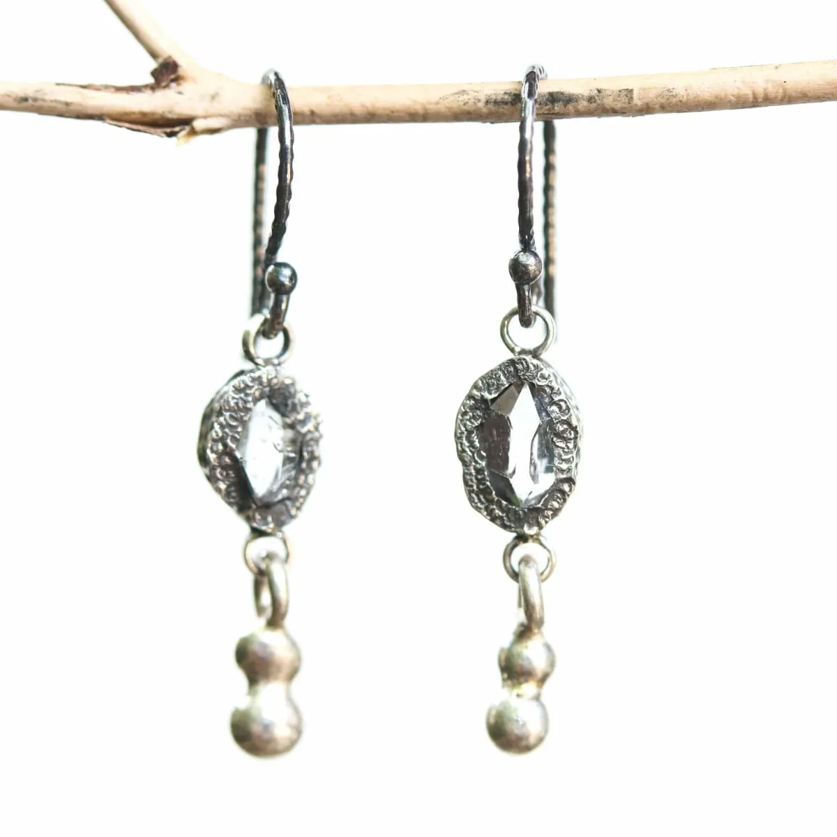 Earrings Clear quartz crystal in silver bezel setting with silver peanut on sterling silver hooks style